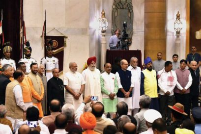 Hamid Ansari, Pranab Mukherjee and Narendra Modi with the newly appointed ministers after their oath taking ceremony at Rashtrapati Bhavan in Delhi, 5 July