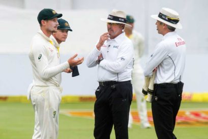 Umpires confront Australia’s Cameron Bancroft after he was caught ball-tampering, for which he was suspended for nine months