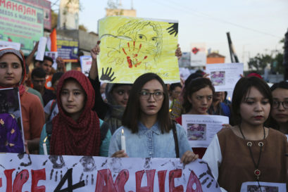 Students participate in a candle light procession in protest against the rape and murder of 8-year-old Asifa, in Jammu, on April 13, 2018
