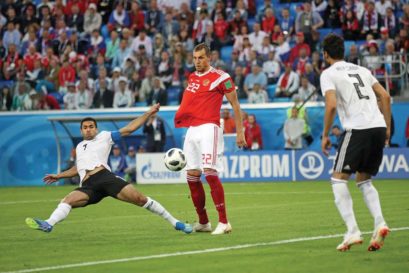 Egypt’s  Ahmed Fathi (far left)  found the back of his  team’s net playing  against Russia