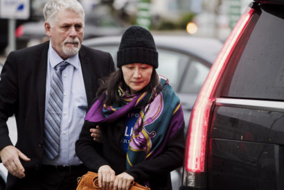 Huawei chief financial officer Meng Wanzhou arrives at a parole office with a security guard in Vancouveron 12 December, 2018