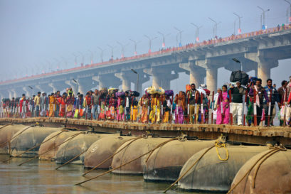 Pilgrims on a pontoon bridge set up for the Kumbh Mela in Prayagraj