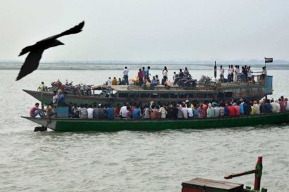 Boats ferry passengers on the Brahmaputra in Dhubri, Assam