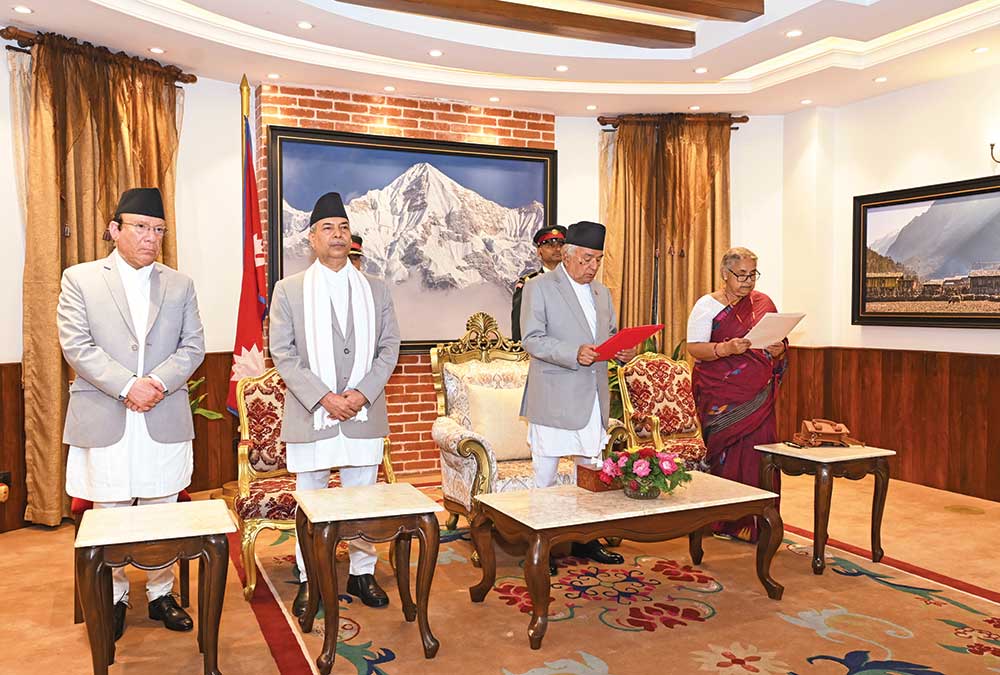Nepal President Ramchandra Paudel (second from right) administers the oath of office to Interim Prime Minister Sushila Karki at the presidential residence, Kathmandu, September 12, 2025